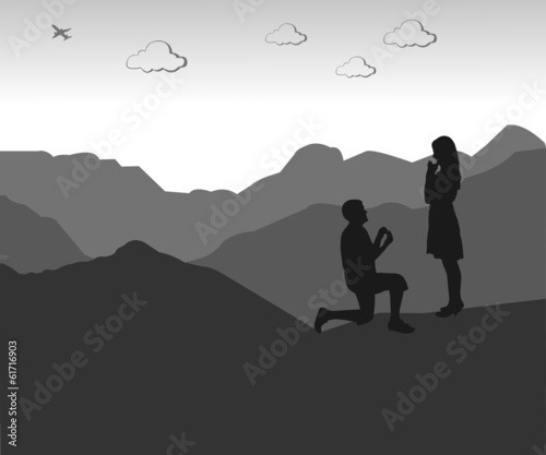Romantic proposal on top of the mountain silhouette