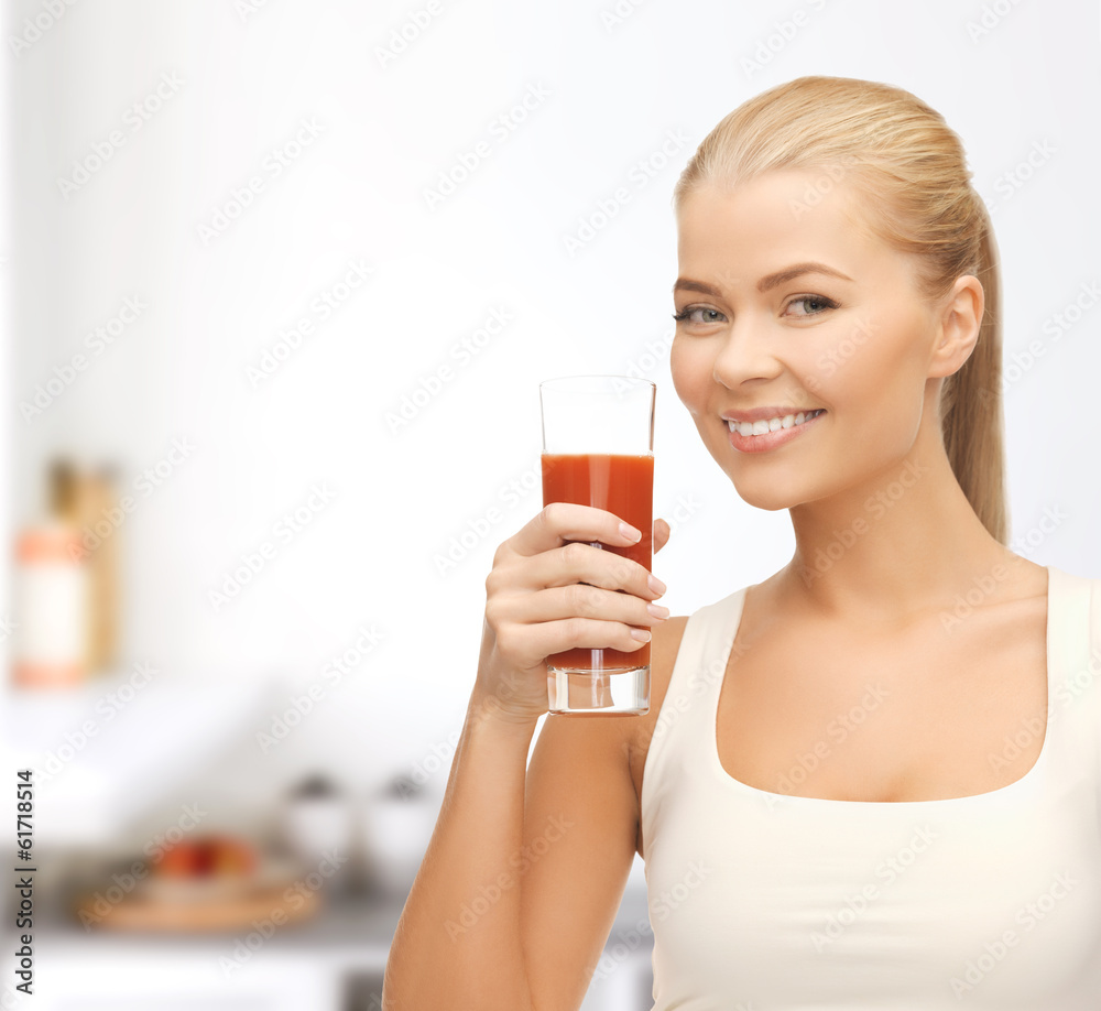 woman holding glass of tomato juice woman holding glass of tomato juice