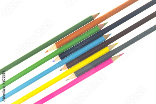 Crossed colorful pencils on white