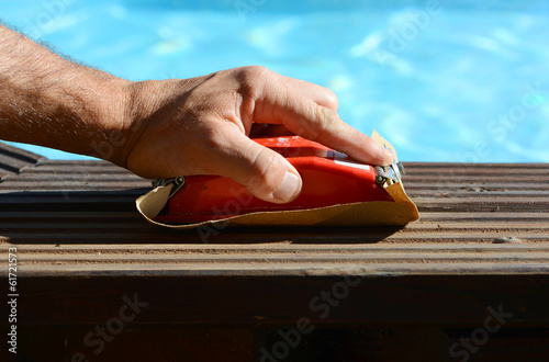 Hand sanded the edge of a pool photo