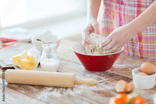 Wallpaper Mural close up of female hands kneading dough at home Torontodigital.ca