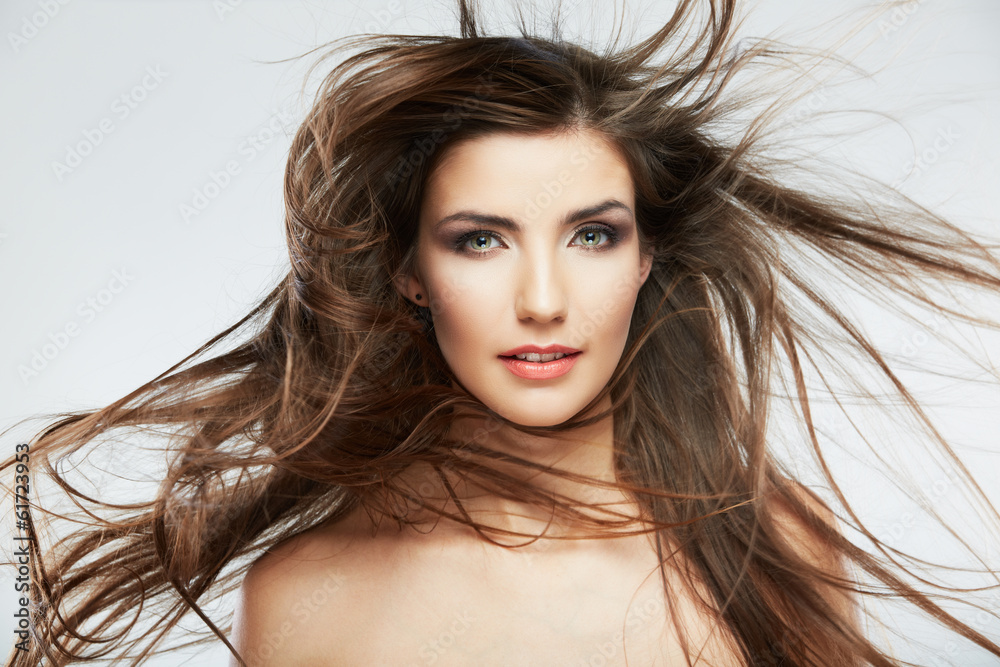 Fototapeta premium Woman face with hair motion on white background isolated