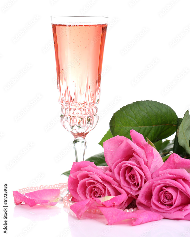 Composition with pink sparkle wine in glass and pink roses Composition with pink sparkle wine in glass and pink roses