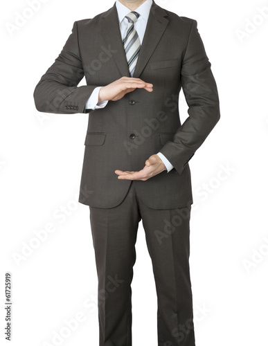 Man in suit holding his hands before him