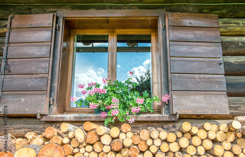 Woodshed. Typical stack of timber just outside alpin wooden hous