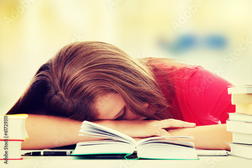 Teenage girl studying at the desk