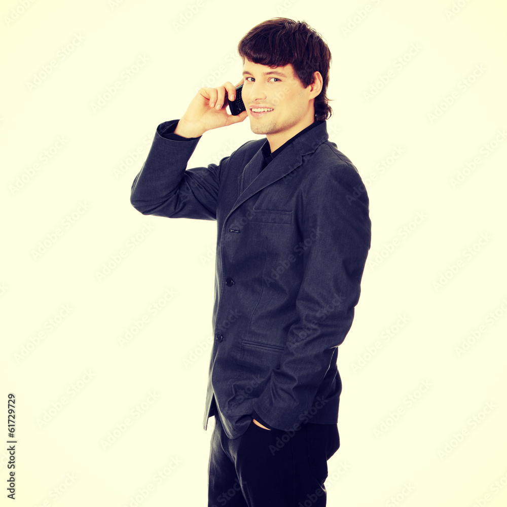Happy business man using mobile phone Happy business man using mobile phone