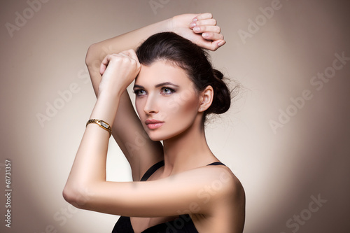 Portrait of luxury woman in exclusive jewelry watch