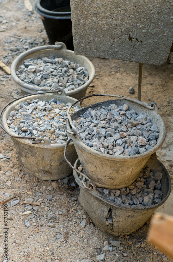 raw material for construction, stone and pail raw material for construction, stone and pail