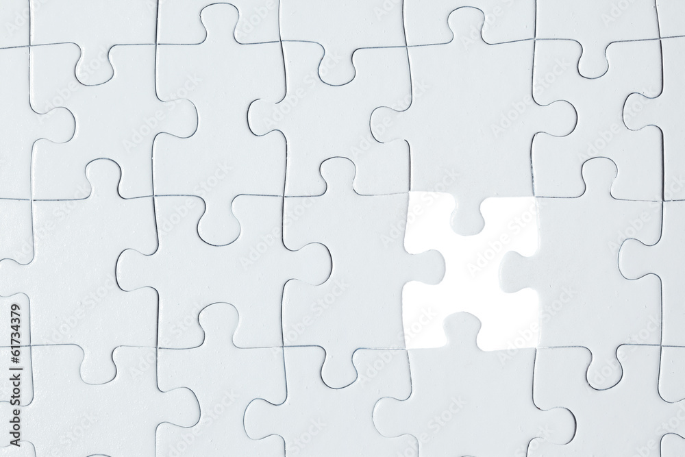 White puzzle with missing piece White puzzle with missing piece