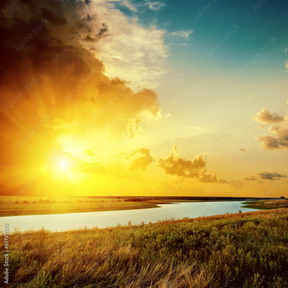 orange sunset over river