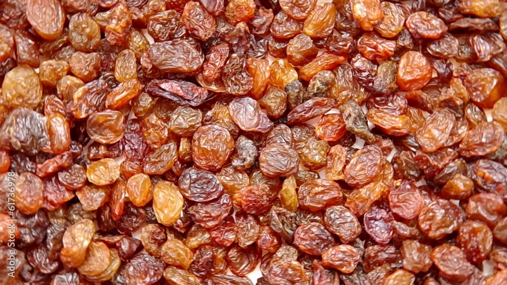 Raisins are spinning on a table. Raisins are spinning on a table.