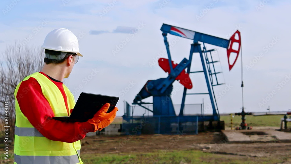 Oil worker check pump jack Oil worker check pump jack