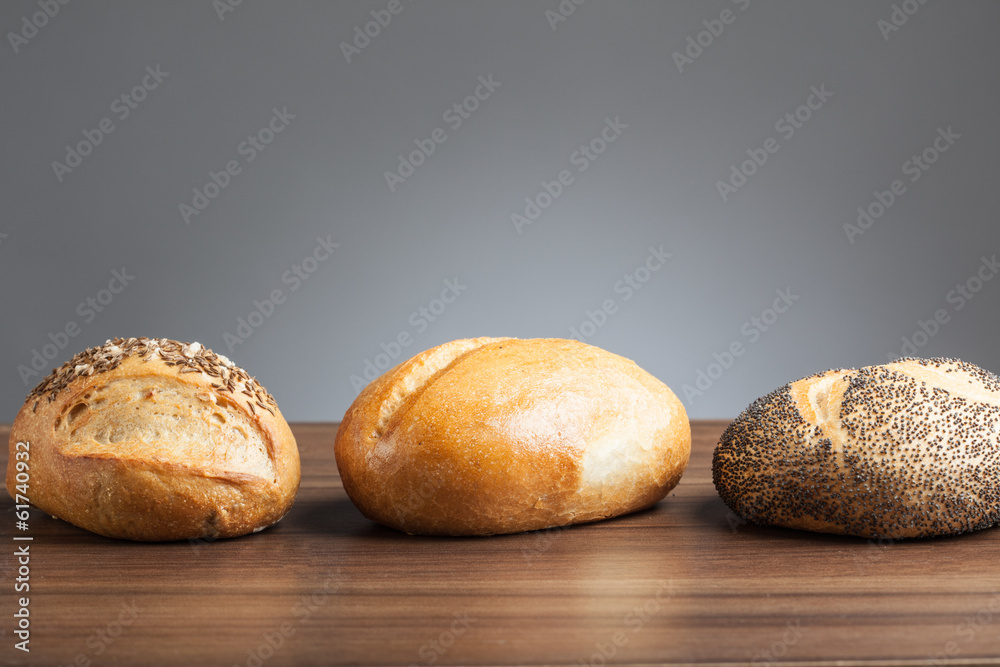 Three Bread rolls on table Three Bread rolls on table