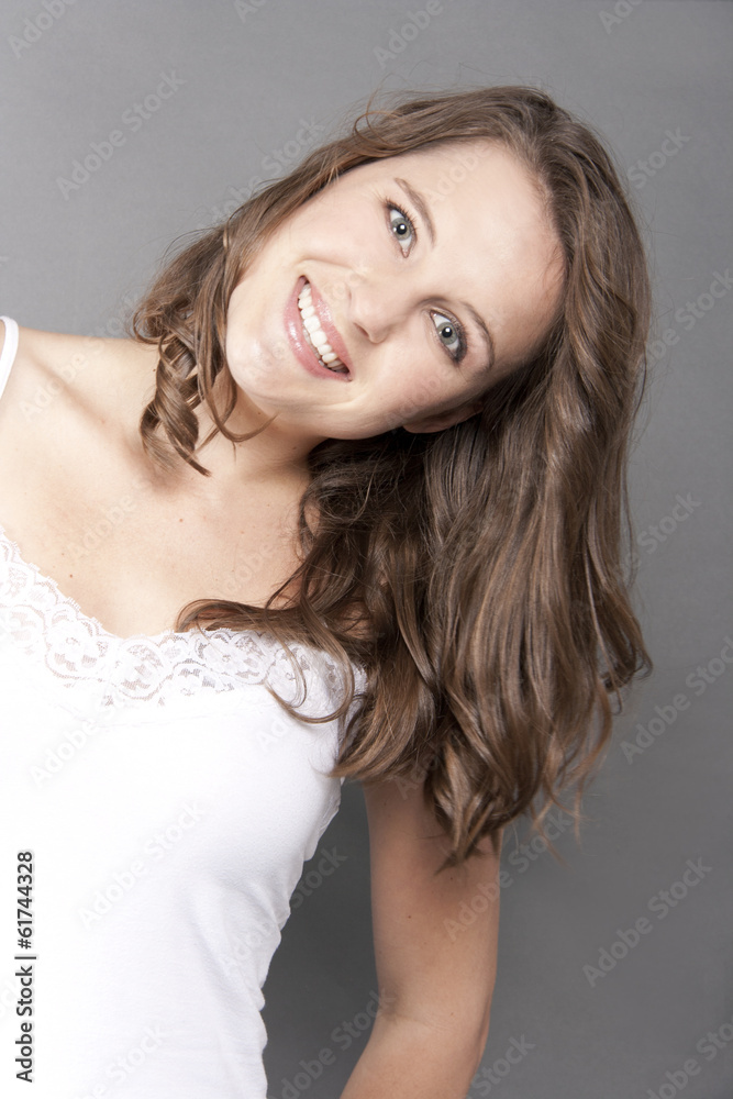 Naklejka premium Beautiful Young Model Playful Smiling isolate grey
