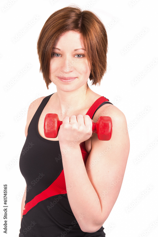 Junge Frau beim Sport mit einer Hantel in der Hand Junge Frau beim Sport mit einer Hantel in der Hand