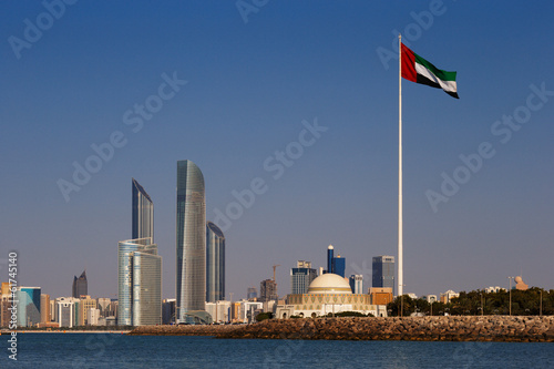 A skyline view of the Abu Dhabi including the UAE National Flag