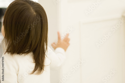 Back View of Japanese Girl standing on door side