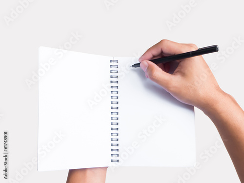 notebook and pen in hand