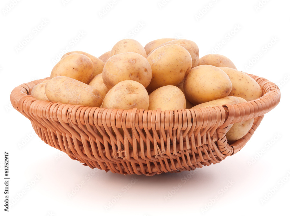 Potato tuber in wicker basket isolated on white background Potato tuber in wicker basket isolated on white background