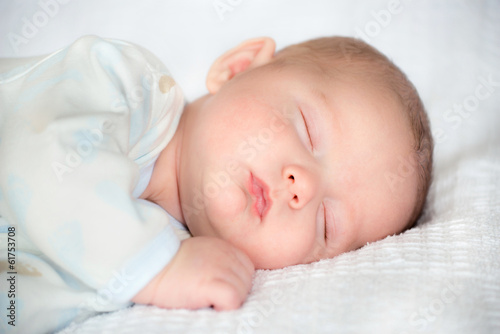 Infant baby boy sleeping peacefully