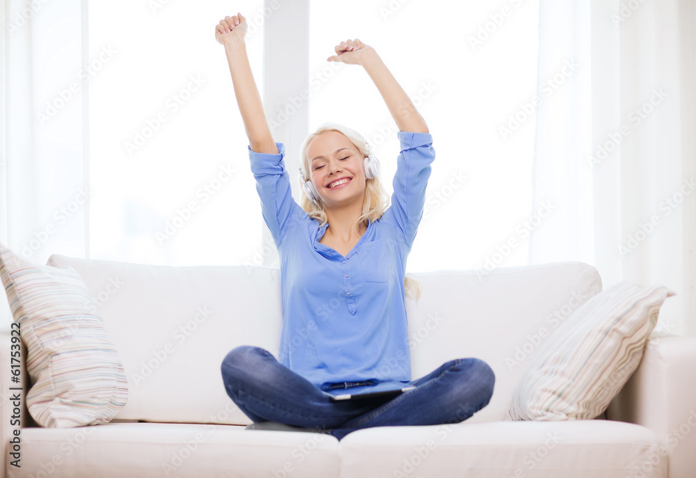 woman with tablet pc and headphones at home woman with tablet pc and headphones at home