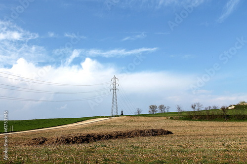 field with electricity pylon