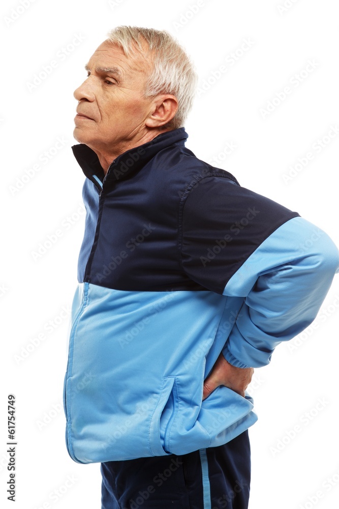 Senior man in training suit feeling pain in his back Senior man in training suit feeling pain in his back