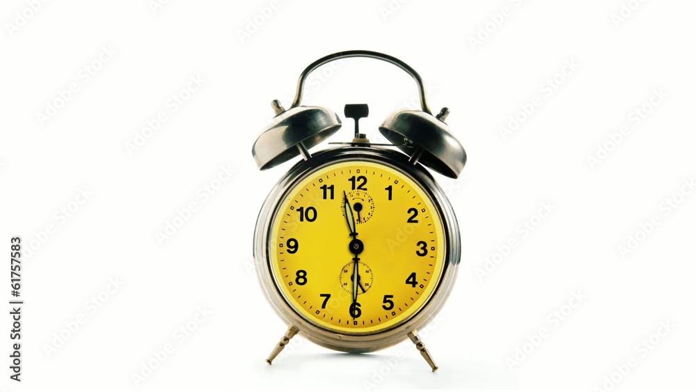 Vintage alarm clock over white background. Time running backward