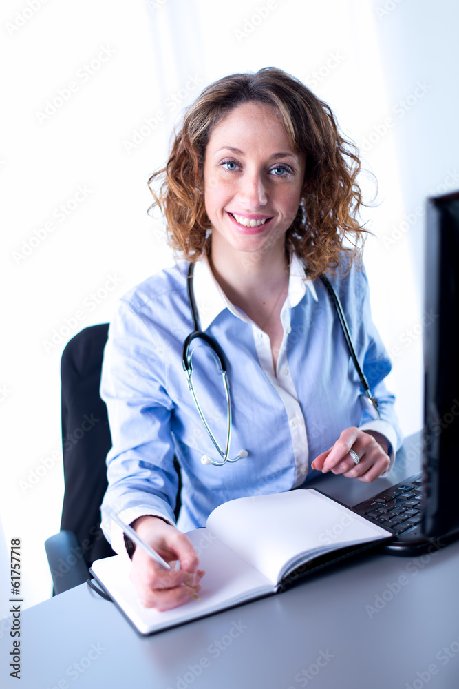 portrait of a beautiful female doctor writing portrait of a beautiful female doctor writing