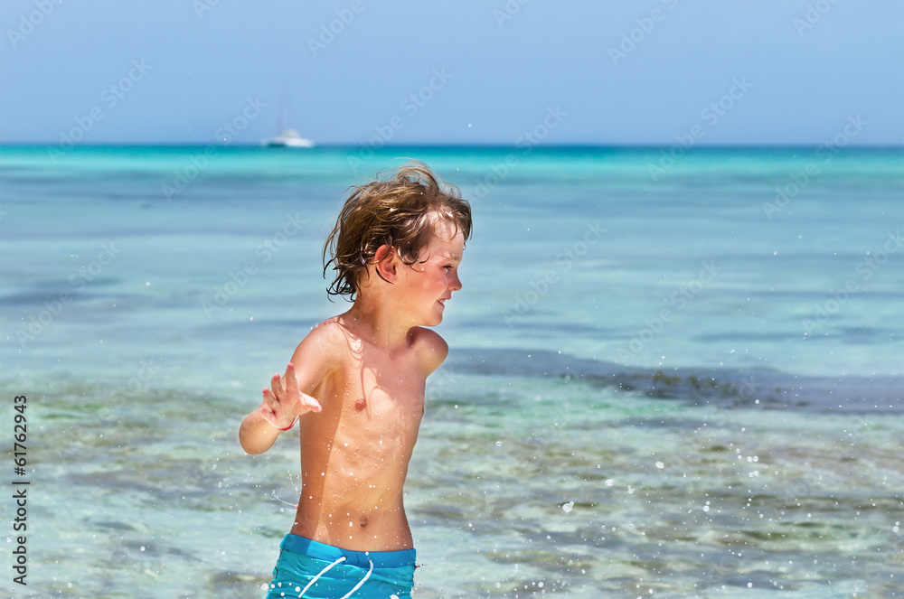 Little boy running on a tropical beach Little boy running on a tropical beach