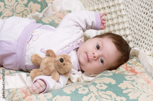 Cute funny infant baby with toy bear