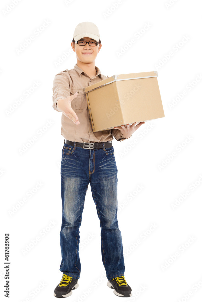smiling delivery man holding parcel and standing smiling delivery man holding parcel and standing