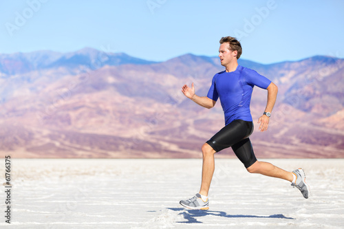 Fototapeta Naklejka Na Ścianę i Meble -  Man running outdoor sprinting for success