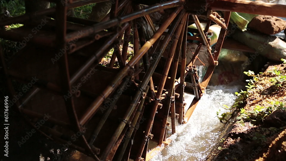 Decorative water wheel in the garden. Decorative water wheel in the garden.