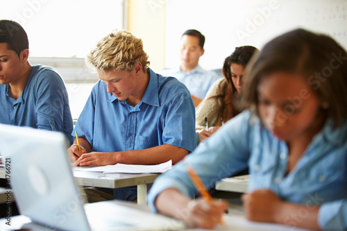 High School Students Taking Test In Classroom © Monkey Business