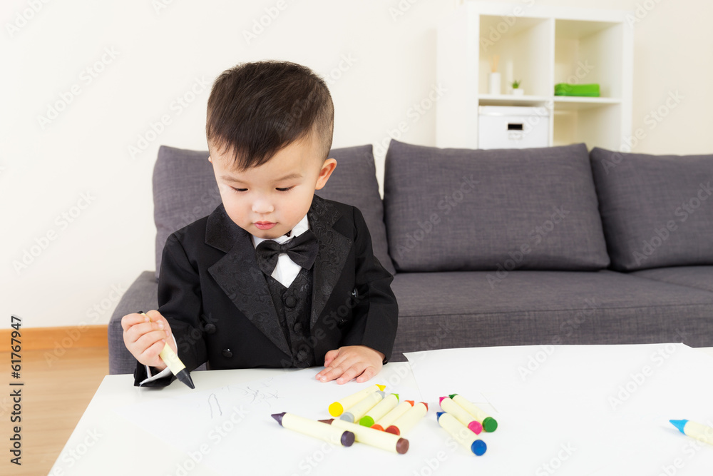 Asian little boy concentrate on drawing Asian little boy concentrate on drawing