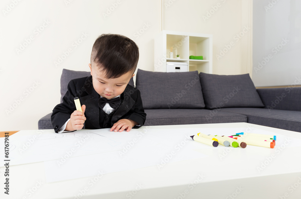 Asia baby boy concentrate on drawing Asia baby boy concentrate on drawing