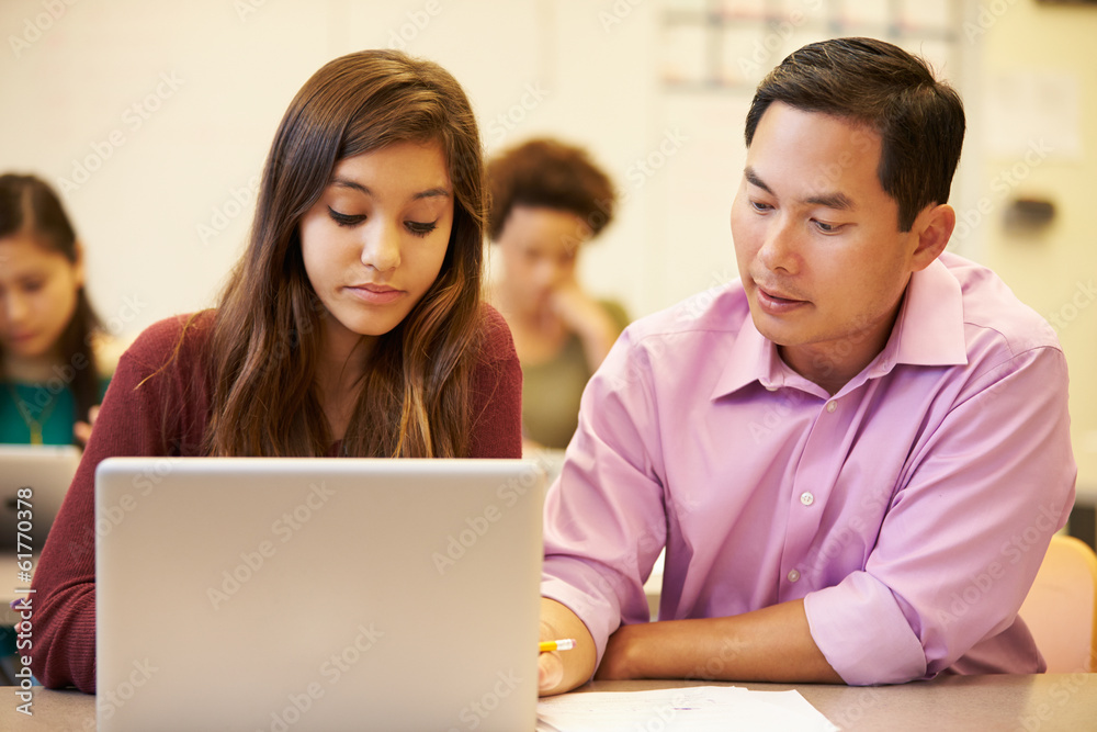 High School Student With Teacher In Class Using Laptop High School Student With Teacher In Class Using Laptop