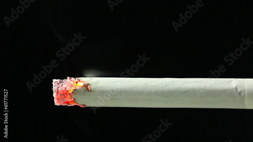 Closeup view of burning cigarette in time-lapse, HD 1080
