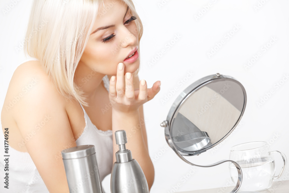 Beautiful Woman Looking at Her Face in the Miror Beautiful Woman Looking at Her Face in the Miror