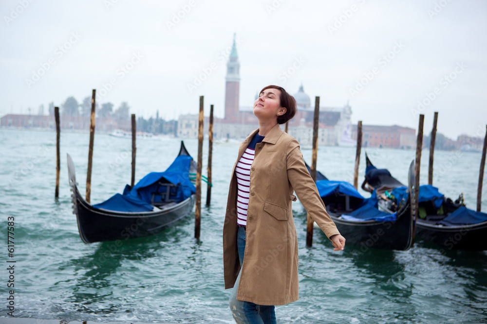 Beautiful woman against Venice panorama