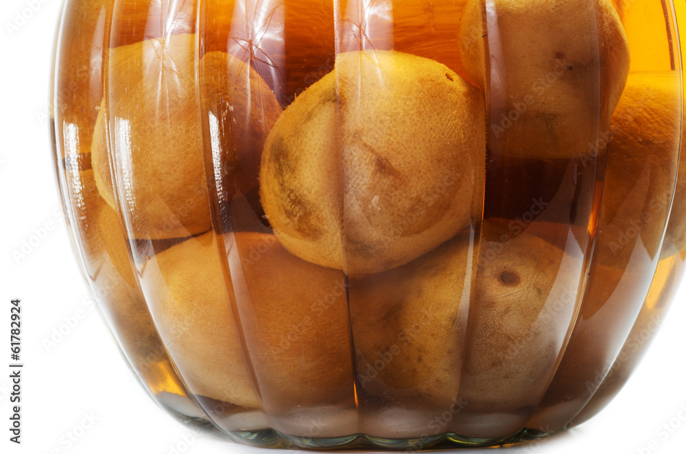 Fototapeta premium Vietnamese salted and pickled limes in a glass jar