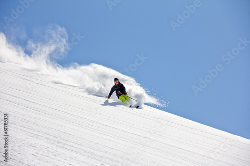 Skier in deep powder, extreme freeride photo
