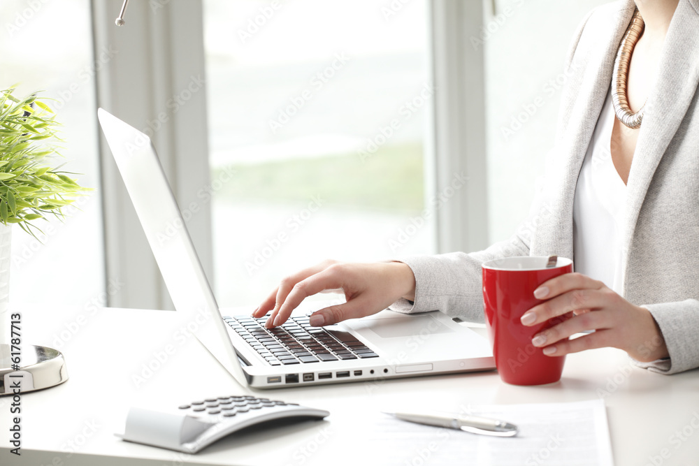 Close-up of businesswoman is typing on her keyboard Close-up of businesswoman is typing on her keyboard