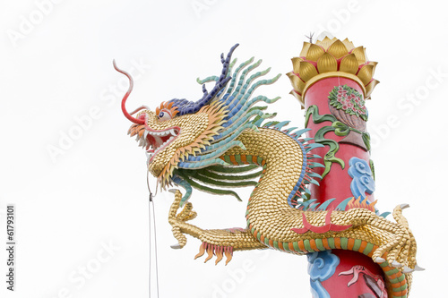 Golden dragon statue on pole in Chinese style