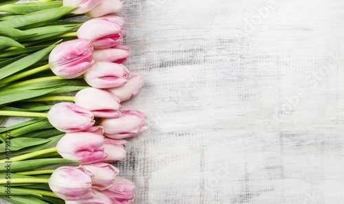 Fototapeta Naklejka Na Ścianę i Meble -  Beautiful pink and white tulips on wooden background. Copy space