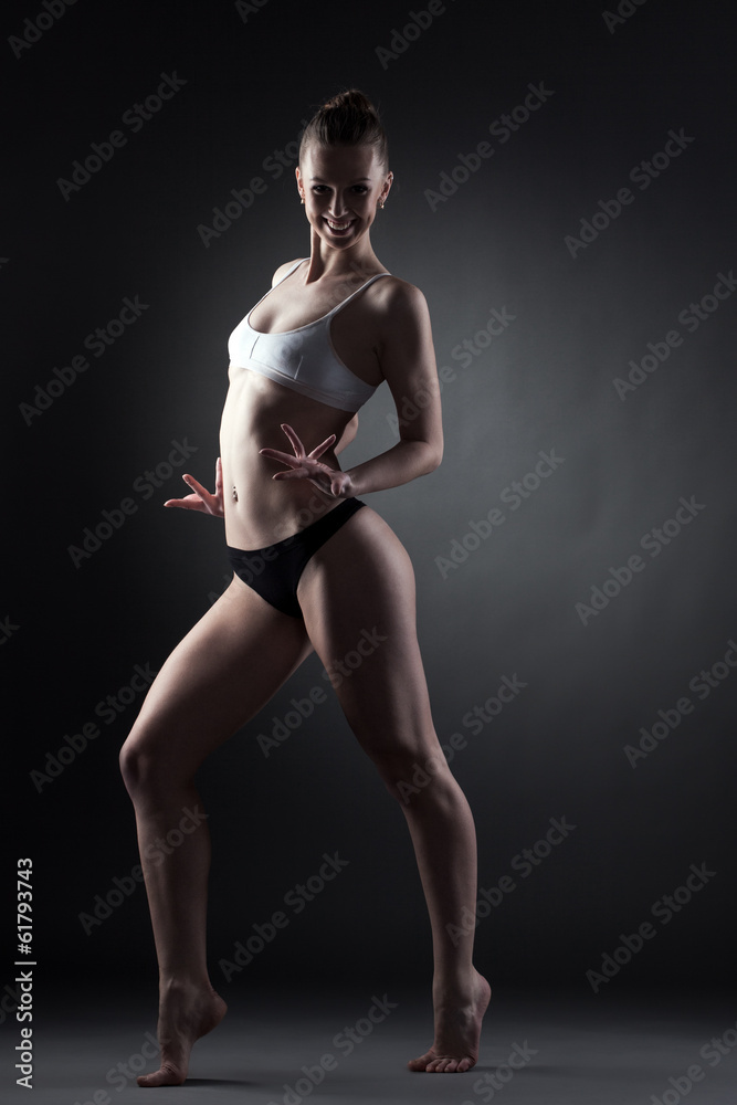 Merry contemporary dancer posing looking at camera Merry contemporary dancer posing looking at camera