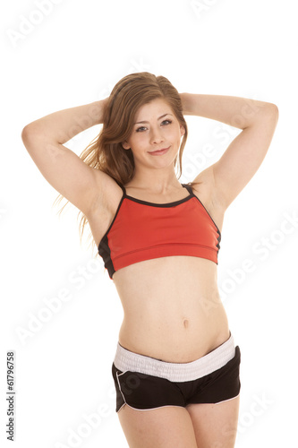 woman shorts and red sports bra hands up Stock Photo
