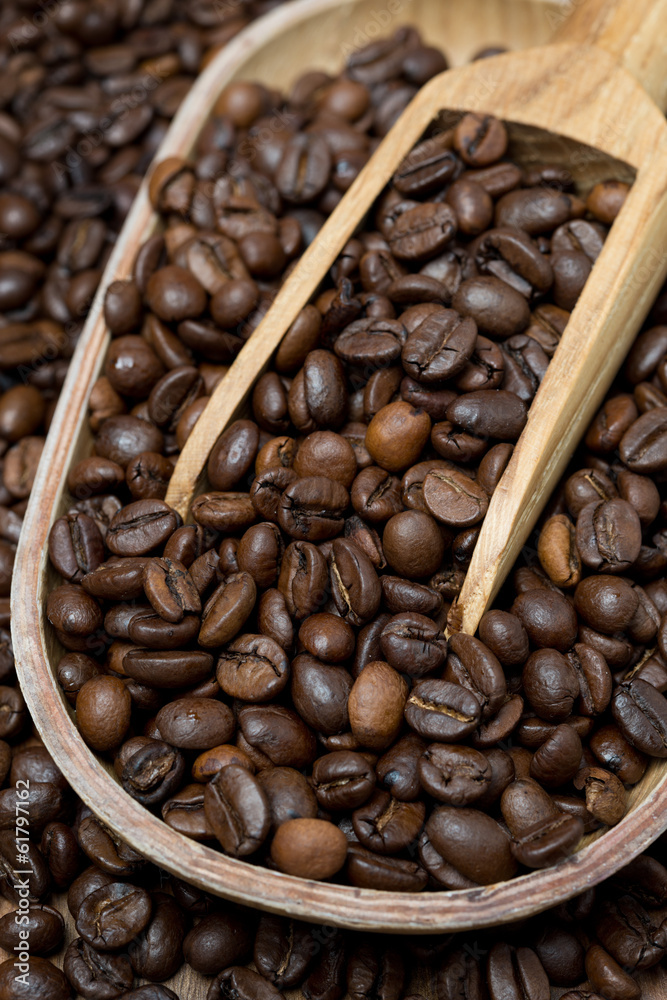 wooden bowl and scoop with coffee beans, vertical wooden bowl and scoop with coffee beans, vertical